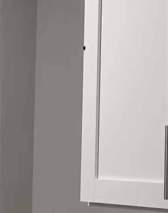 Cat Hides Under Refrigerator