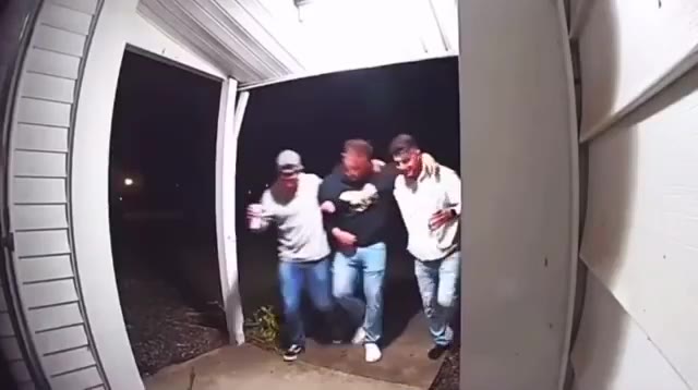 Drunk guys takes out pizza slicer instead of keys then fell on the floor.