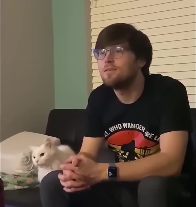 Guy Cuddles Fluffy White Cat
