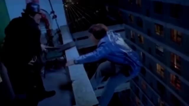 Guy Reaches Over Ledge