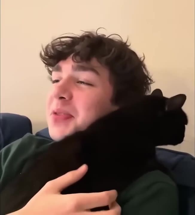 Holding Adorable Black Cat