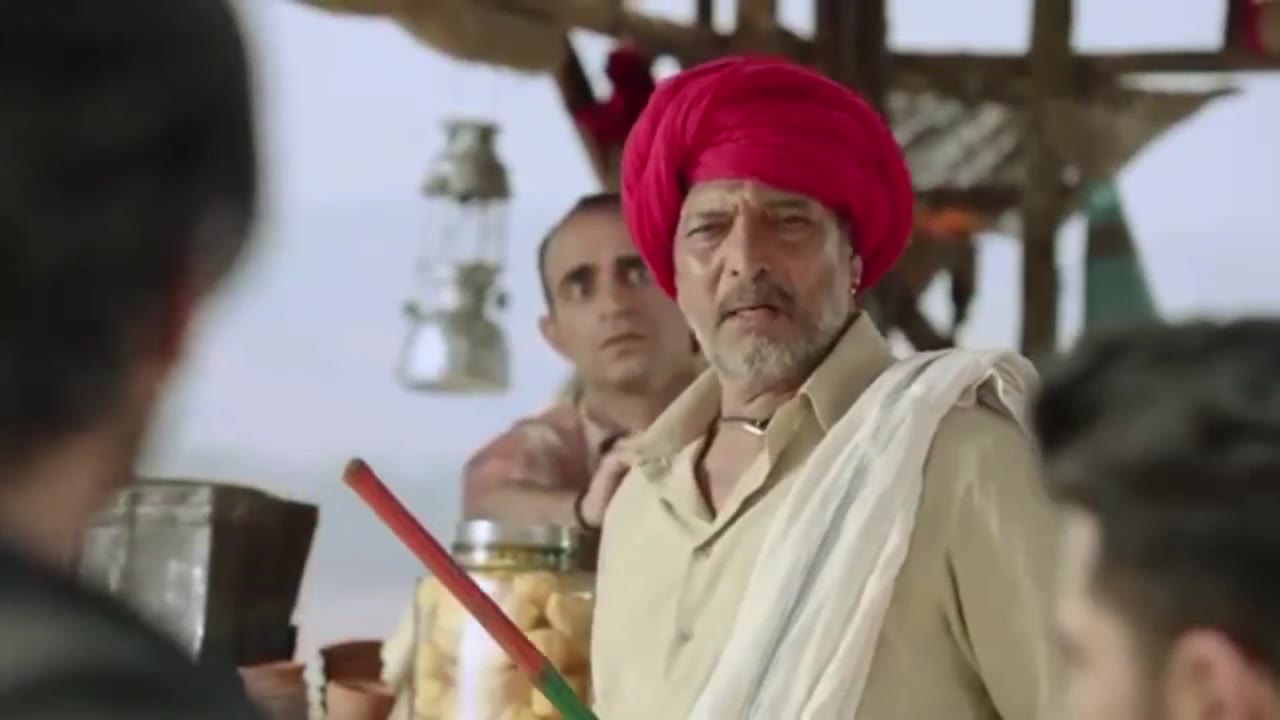 Man In Red Turban Looks Away