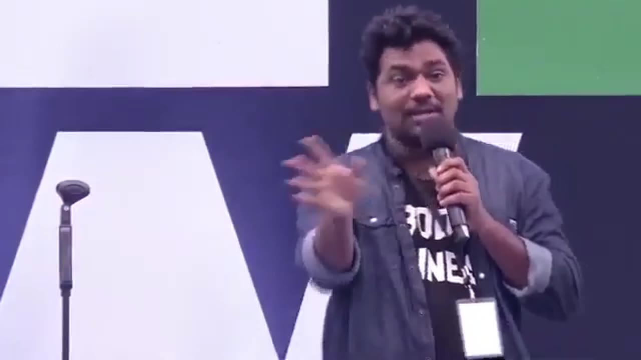 Man Laughs Into Microphone