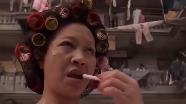 Woman With Curlers Waiting